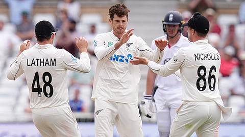 New Zealand's Mitch Santner (centre) celebrates with team-mates after taking the wicket of England's Gus Atkinson on day five of the Third Cricket Test at Trent Bridge Cricket Ground, Nottingham, England, Monday June 29, 2026.