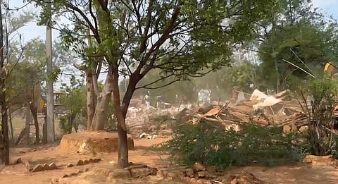 As heavy machinery ripped through walls and roofs, women broke down in tears.