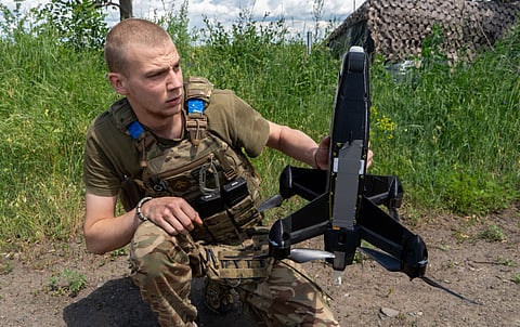 A Ukrainian serviceman of Khartia brigade launches an interceptor drone in Kharkiv region, Ukraine, Friday, June 26, 2026.