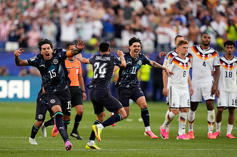 Paraguay players rejoice after the match on Monday