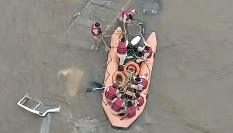 Fire and emergency service personnel searching for tipper driver in Krishna river near Kolhar village on Wednesday.