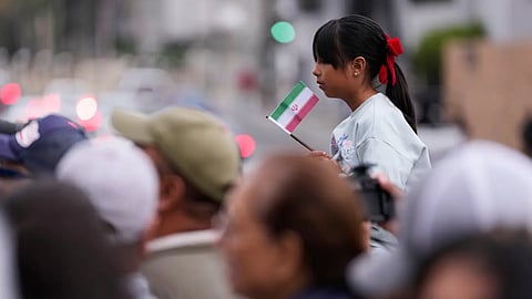 Fans wait to greet members of the Iran World Cup soccer team as they leave their hotel for the airport Tuesday, June 30, 2026, in Tijuana, Mexico.