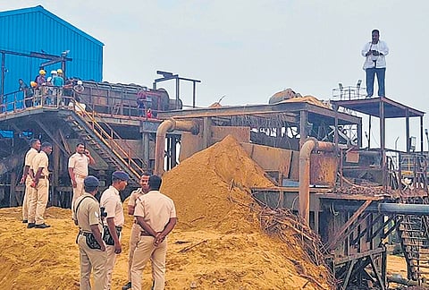 Reddy atop the feeding plant machine as police personnel stand guard | EXPRESS
