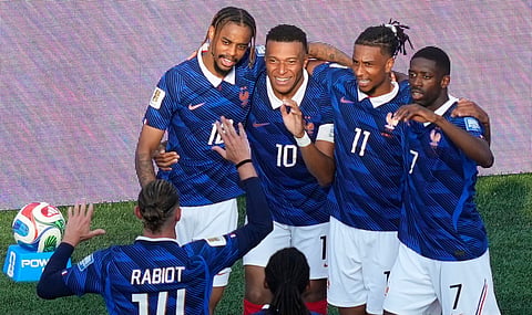 Kylian Mbappe (10) celebrates after scoring against Sweden