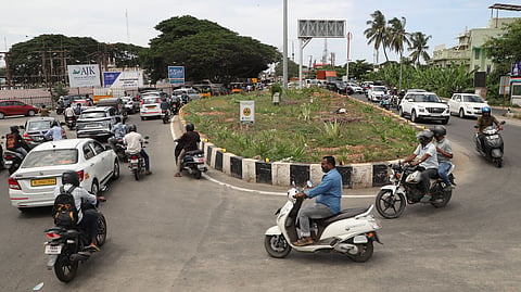 Vehicles ply on the Pullukkadu Junction at Ukkadam in Coimbatore on Wednesday.