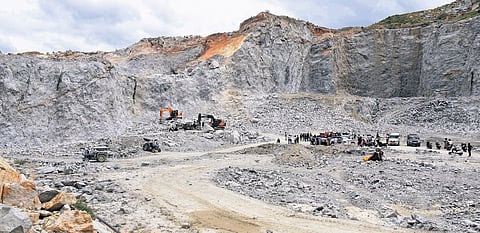 Police and emergency personnel at the stone quarry in Huluvenahalli village.