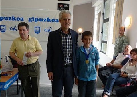 12-year-old Martin Zubimendi (R) and chess coach Inigo Argandona after winning a regional tournament