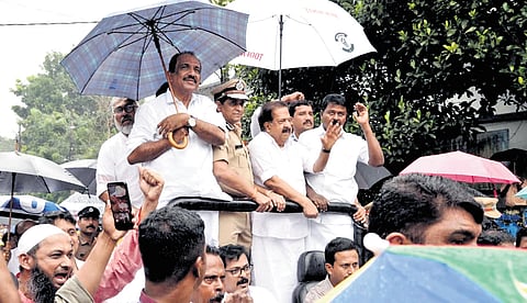 Home Minister Ramesh Chennithala, along with DGP Ravada A Chandrashekhar, leading the Operation Toofan Jagaran Rally in Perumbavoor on Friday, amid heavy rain. MP Benny Behanan is also seen