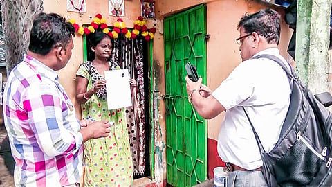 A Special Intensive Revision (SIR) official during the house-to-house verification process to update voter list, the exercise to verify and update India’s voter lists.