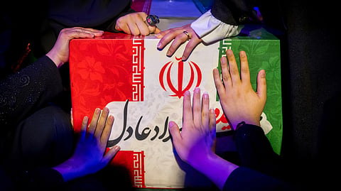 Mourners touch the coffin of Zahra Haddad-Adel, daughter of former Iranian parliament speaker Gholam-Ali Haddad-Adel and wife of Iran's Supreme Leader Mojtaba Khamenei, during her funeral in Tehran, Thursday, July 2, 2026. According to Iranian authorities she was killed in the same strike that killed then-Supreme Leader Ali Khamenei.