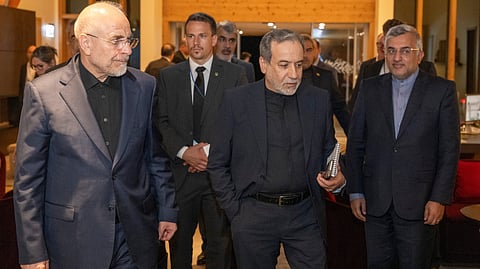 Iranian Foreign Minister Seyyed Abbas Araghchi, center, and Speaker of the Islamic Parliament of Iran Mohammed Bagher Ghalibaf, left, arrive at the Buergenstock resort in Obbuergen, near Lucerne, Switzerland, early Sunday, June 21, 2026.