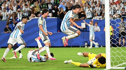 Argentina's defender #13 Cristian Romero (L) celebrates scoring his team's third goal during the 2026 World Cup round of 32 football match between Argentina and Cape Verde at the Miami Stadium in Miami Gardens on July 3, 2026.