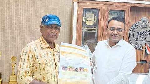 Sambalpur collector Bondar handing over the work order to Jitendra Haripal