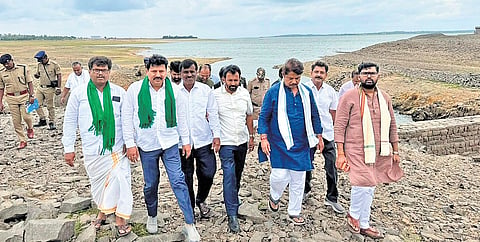 BJP leaders inspect the KRS reservoir built across the Cauvery river in Mandya district on Saturday.