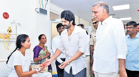 Actor Vijay Deverakonda and BRS leader Harish Rao interact with children recovering from heart surgeries at a hospital in Siddipet on Saturday