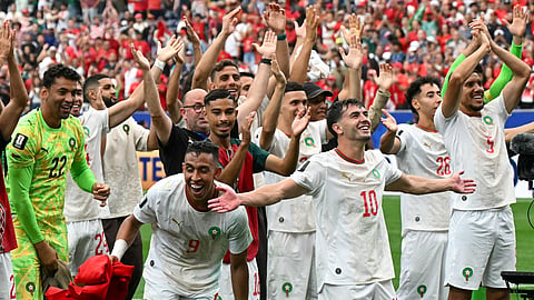 Morocco's forward #09 Soufiane Rahimi (bottom L), Morocco's forward #10 Brahim Diaz and teammates celebrate after winning the 2026 World Cup round of 16 football match between Canada and Morocco at the Houston Stadium in Houston on July 4, 2026.