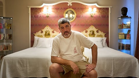 Former concierge and receptionist Fernando Hualde poses at the Ernest Hemingway suite at the Gran Hotel La Perla in Pamplona, northern Spain, Thursday, July 2, 2026.