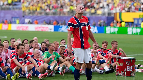 Norway's Erling Haaland (9) leads the team as they participate in a viking boat row after the World Cup round of 16 soccer match against Brazil East Rutherford, N.J., Sunday, July 5, 2026.