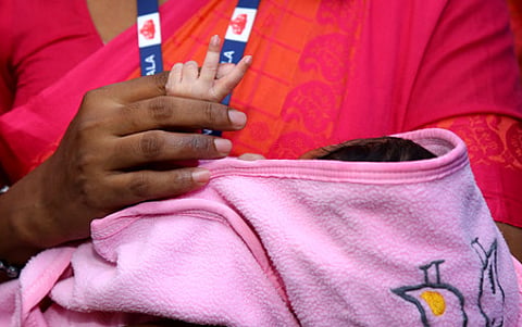 Child Welfare Committee officials receive an abandoned newborn from the Special Newborn Care Unit (SNCU) of Ernakulam General Hospital