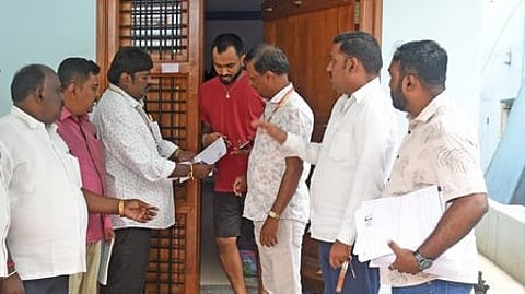 Booth-level officers distribute SIR Enumeration forms in Bengaluru.