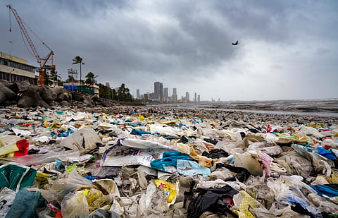 Waste washed ashore following a high tide at Dadar Beach, in Mumbai, Tuesday, July 7, 2026.