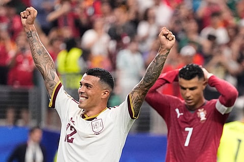 Spain's Pedro Porro (12) and Portugal's Cristiano Ronaldo (7) react after Spain defeated Portugal in the World Cup round of 16 soccer match in Arlington, Texas, near Dallas, Monday, July 6, 2026.
