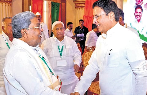 Former CM Siddaramaiah greets AICC General Secretary Randeep Singh Surjewala during the KPCC all-member meeting in Bengaluru on Tuesday.