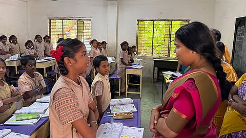 Industries Minister S Keerthana interacting with students of a government school near Sivakasi