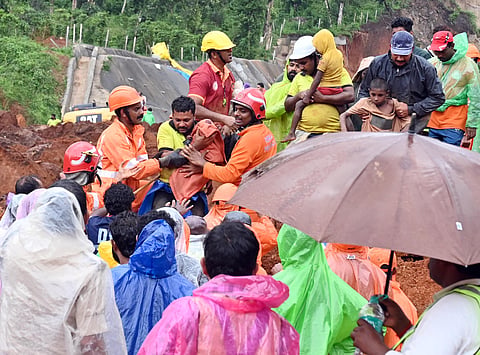 The plantation workers and families being shifted safely after they stranded on the other side of landslip hit Kalladi on Meppadi - Chooralmala Road, Wayanad