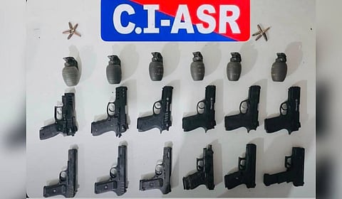 The recovered cache includes eight .30 bore pistols, four 9 mm pistols and nine live cartridges.