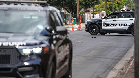 Police work on Canal Street in Houston, Tuesday, July 7, 2026, after a shooting.