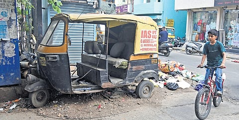An abandoned autorickshaw on Thimmaiah Road in Bengaluru.