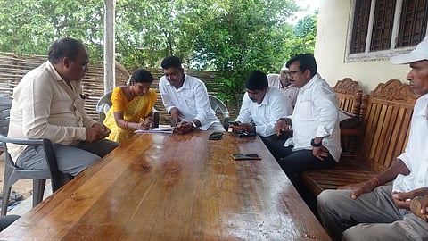 The political parties Booth Level Agents(BLA's) helping the voters of filling the Special Intensive Revision (SIR) application forms in Tadvai Mandal in Mulugu district.