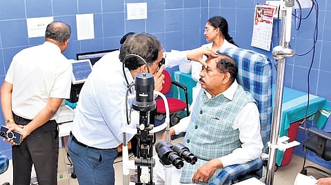 Deputy Chief Minister Dr G Parameshwara undergoes eye check-up at the district hospital in Tumakuru on Wednesday.