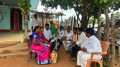 The political parties Booth Level Agents(BLA's) helping the voters of filling the Special Intensive Revision (SIR) application forms in Tadvai Mandal in Mulugu district.