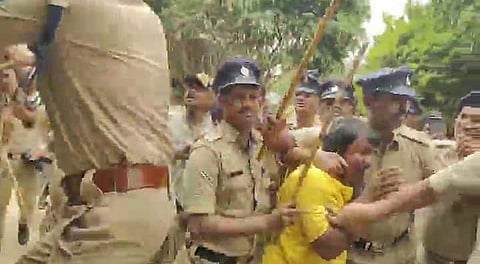 Police controling the crowd after 12-year-old Class 6 student died under suspicious circumstances at Sterling English Residential School in Yelahanka, triggering allegations of assault by teachers and intense academic pressure.