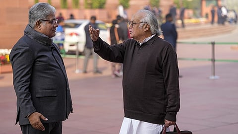 Union Minister Bhupender Yadav with Congress MP Jairam Ramesh in Parliament premises.