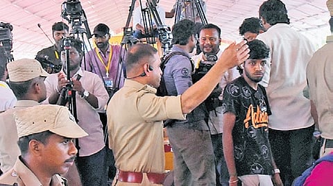 Police removing media persons from the venue of Chief Minister C Joseph Vijay’s meeting in Karur
