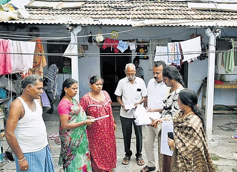 Officials issue enumeration forms to residents as part of the SIR process at Vidyanagar in Karimnagar on Thursday