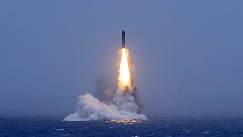 In this photo released by Xinhua News Agency, a long-range ballistic missile bursts out of the sea during a test launched from a Chinese nuclear-powered submarines in the South Pacific on Monday, July 6, 2026.