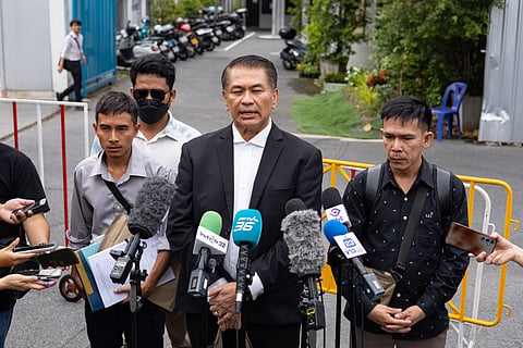 Lawyer Kunpat Singhathong and three sailors from the Thailand-flagged ship, the Mayuree Naree, speak to journalists outside the Central Labour Court in Bangkok, Thailand on Friday, July 10, 2026.