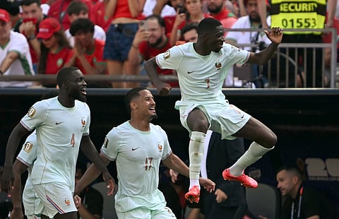 Ousmane Dembele (R) celebrates with his teammates on Thursday