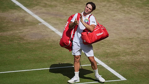 Arthur Fery of Britain applauds to the public as he leaves the court after losing to Alexander Zverev of Germany in their men's singles semifinal match at the Wimbledon Tennis Championships in London, Friday, July 10, 2026.