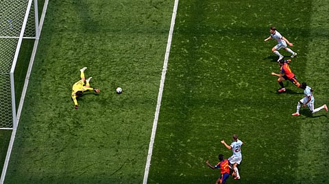 Belgium goalkeeper Senne Lammens (12) spills the ball as Spain's Mikel Merino (6), center left, closes in to score their second goal during the World Cup quarterfinal soccer match between Spain and Belgium in Inglewood, Calif., near Los Angeles, Friday, July 10, 2026.