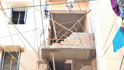 Scaffolding installed at the balcony of the TNUHDB tenement in SM Nagar, which is undergoing renovation.