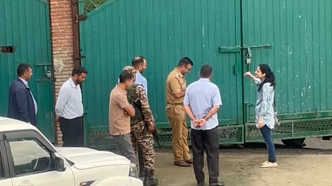 PDP leader Iltija Mufti speaks with officials at the entrance to her home in the Khimber area on the outskirts of Srinagar on Sunday, July 12, 2026.
