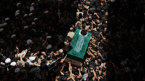 The coffin of the late Iranian Supreme Leader Ayatollah Ali Khamenei is carried by mourners to the Imam Ali Shrine in Najaf, Iraq, Wednesday, July 8, 2026.