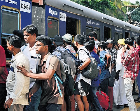 Commuters wait to board suburban trains at Tambaram railway station after an hour-long wait as Southern Railway partially cancelled local train services on the Chennai Beach-Tambaram and Chennai Egmore-Villupuram sections