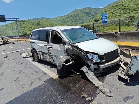This handout photo released by the Security and Civil Protection Secretariat of Nayarit state shows a damaged minivan at the scene of a road accident on the Guadalajara-Tepic highway in Jalisco state, Mexico, on July 12, 2026.