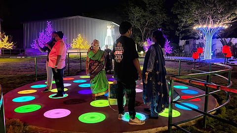 Visitors at the glow garden in Mamallapuram.